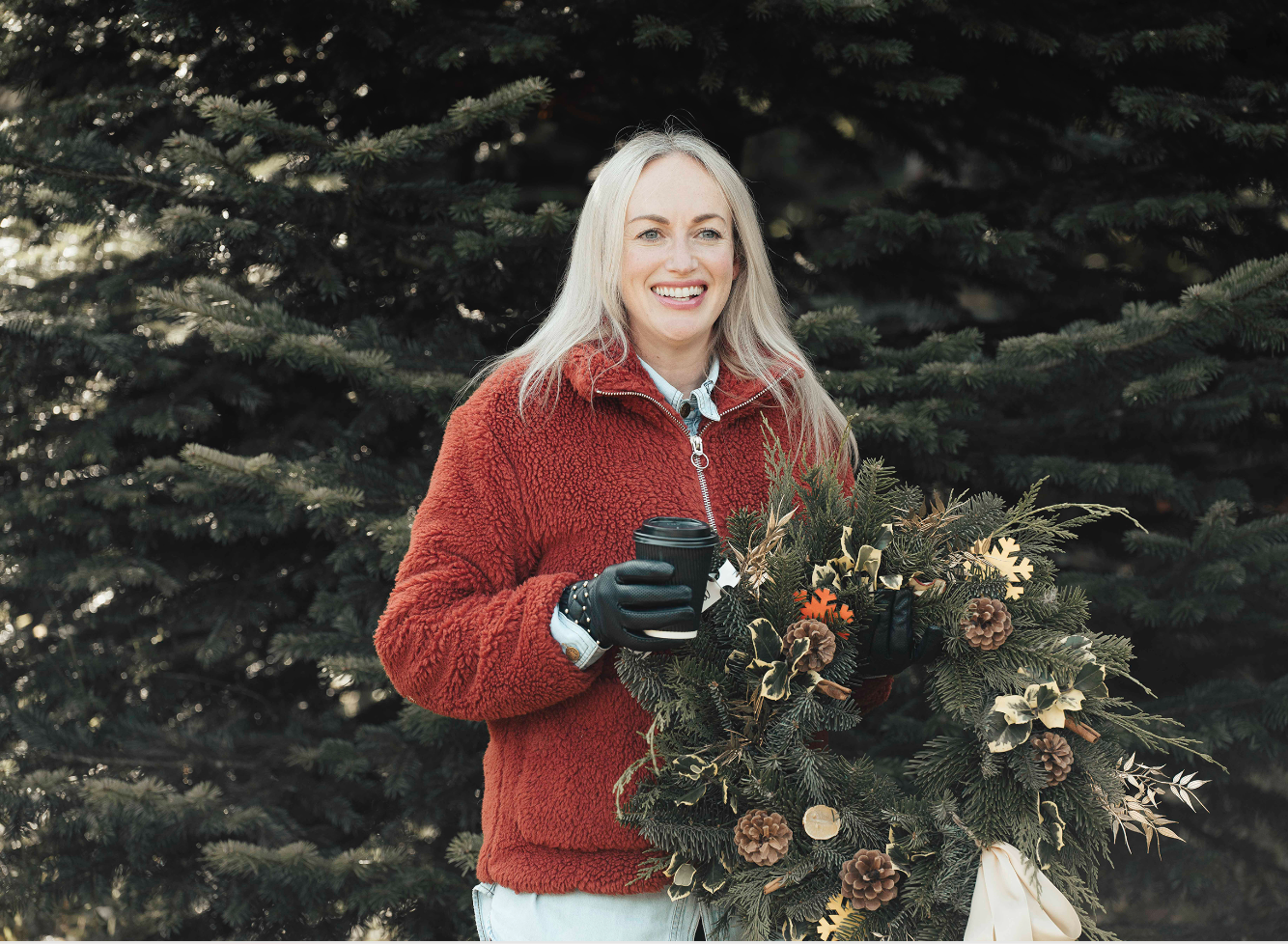 Woman with Decorated Christmas Wreath